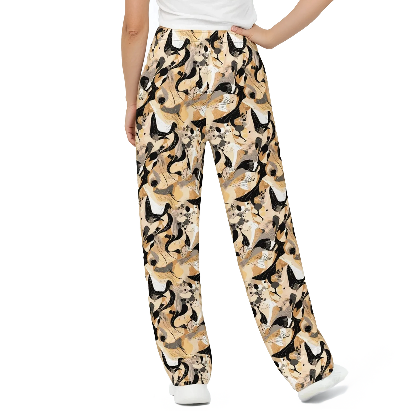 Person wearing Strata wide-leg pants with bird pattern, showcasing comfort and style.