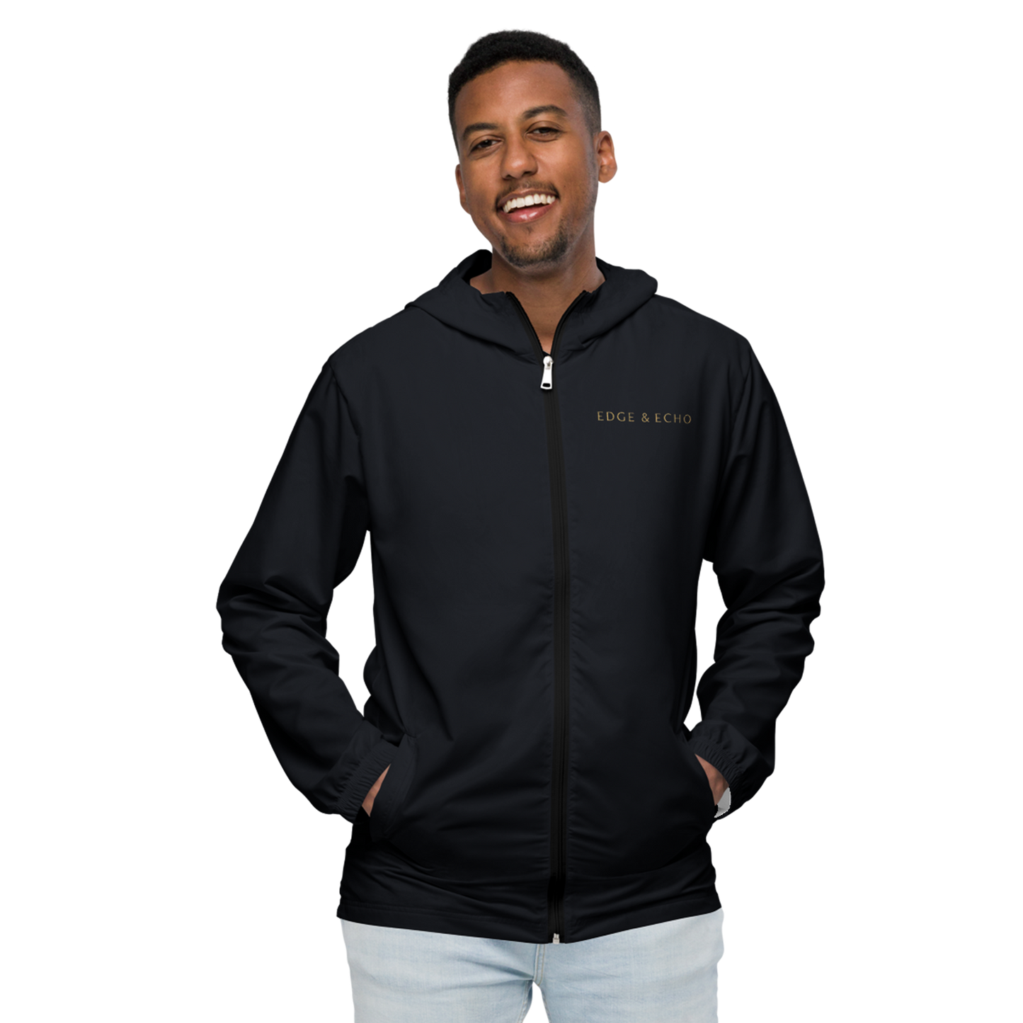 Man smiling while wearing the Edge & Echo Windbreaker.