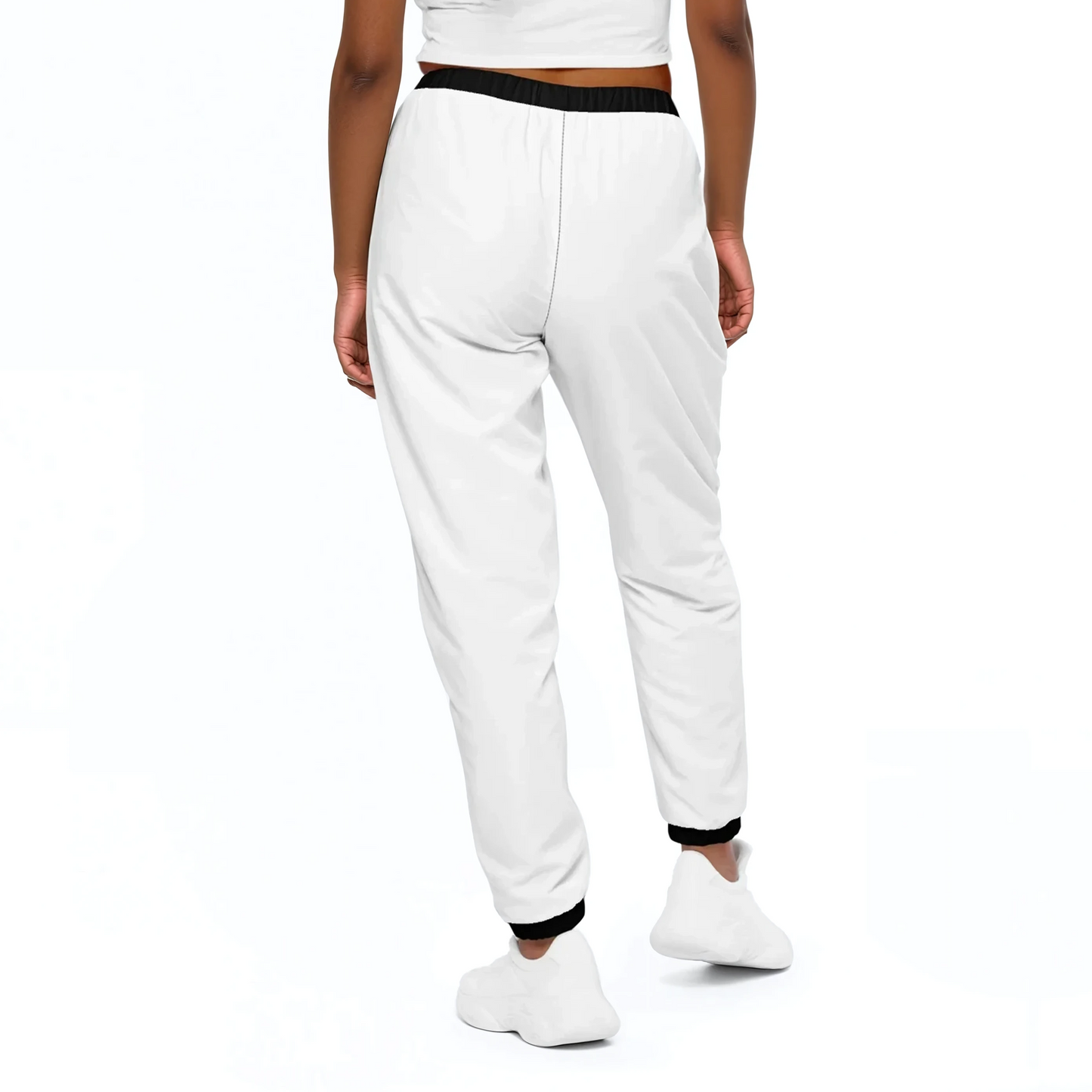 White Edition Track Pants on person, showcasing elastic ankle cuffs over white socks.