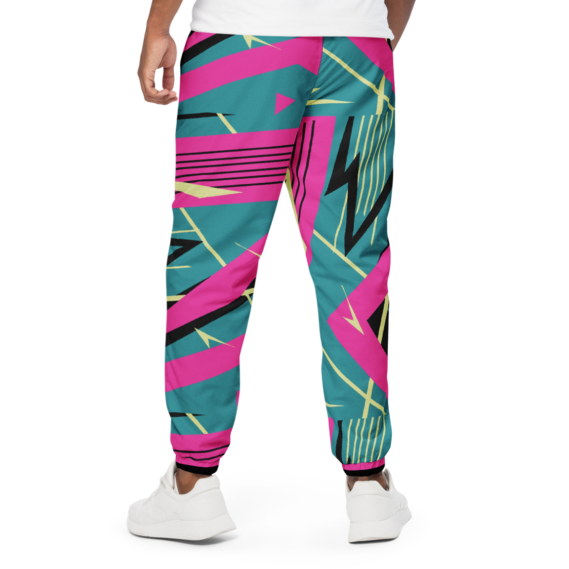 YMotion Track Pants with elastic cuffs, highlighting sneakers. Perfect for stylish workouts.