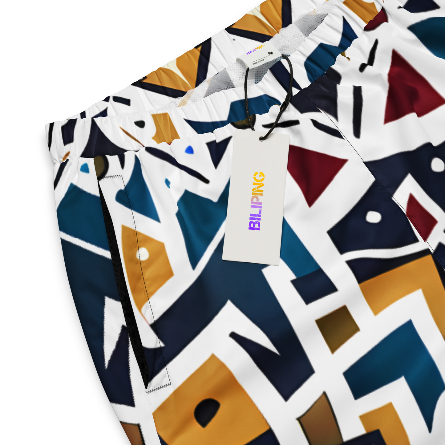 Spectra Shift Track Pants with white tag attached, showcasing relaxed fit.