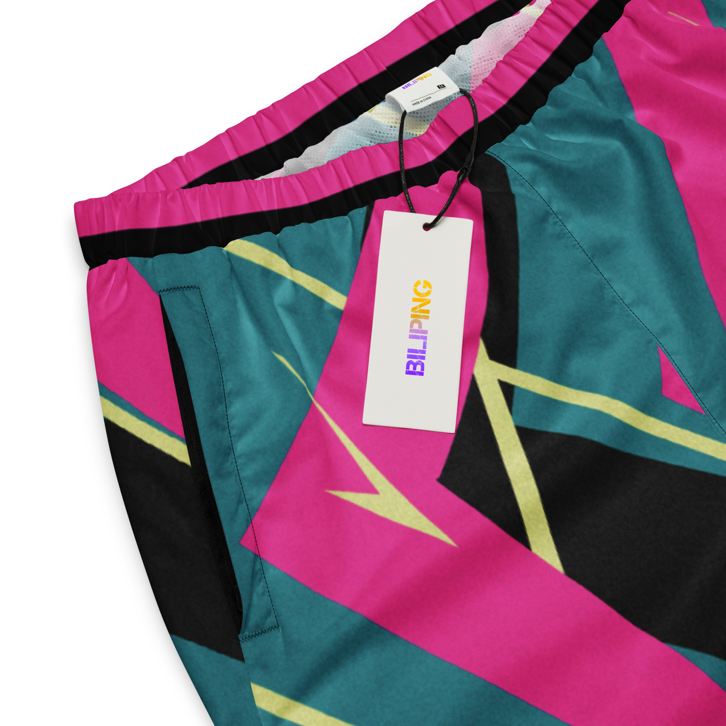 YMotion Track Pants with price tag, highlighting elastic cuffs and drawcord.