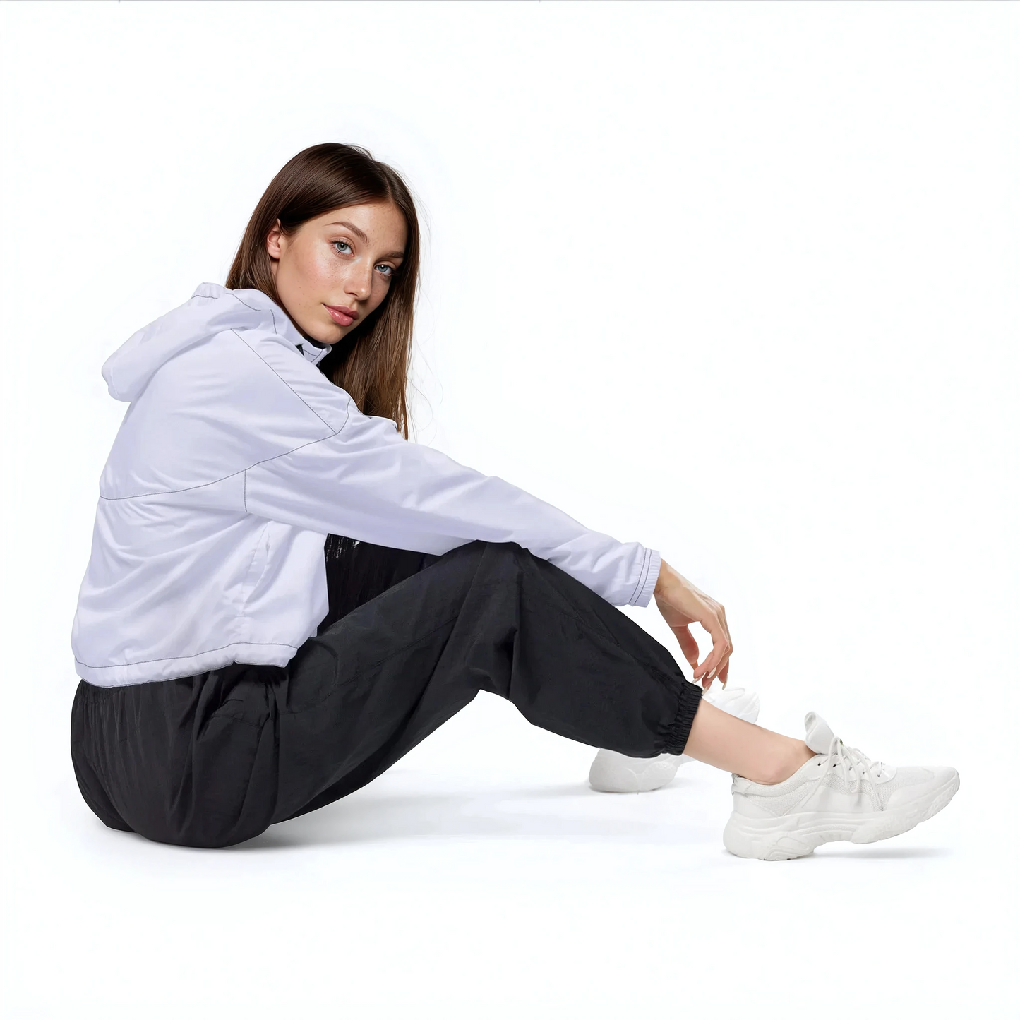 Lilac Loop Windbreaker on woman sitting, showcasing its functional design.