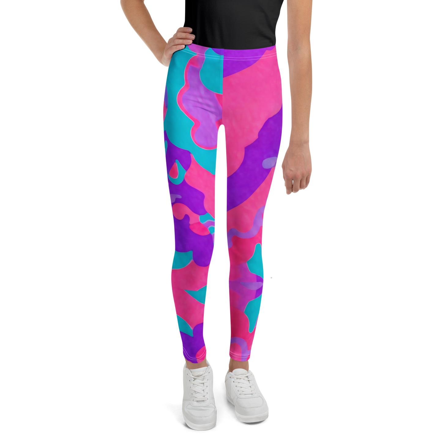 Wonderweave Pants: Close-up of hand adjusting vibrant youth leggings.
