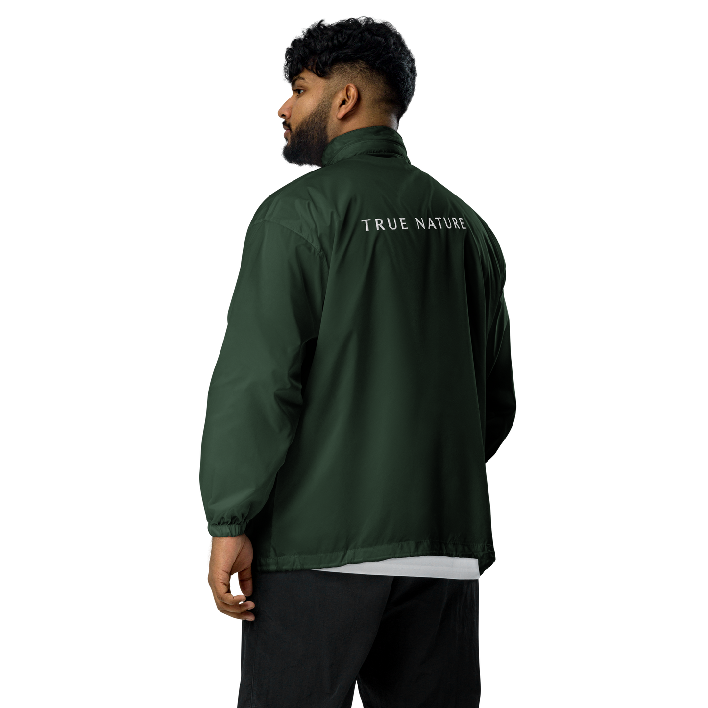 True Nature Windbreaker worn by man, featuring zip-up front and drawstring hood.