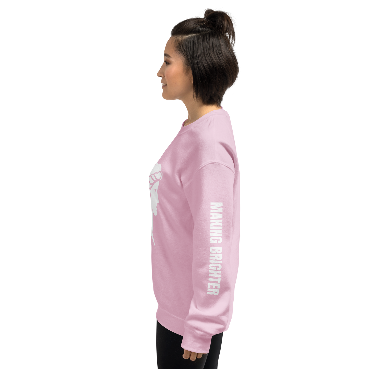 She Illuminates Pathways sweatshirt; woman's hand highlights sleeve's soft, cozy texture.