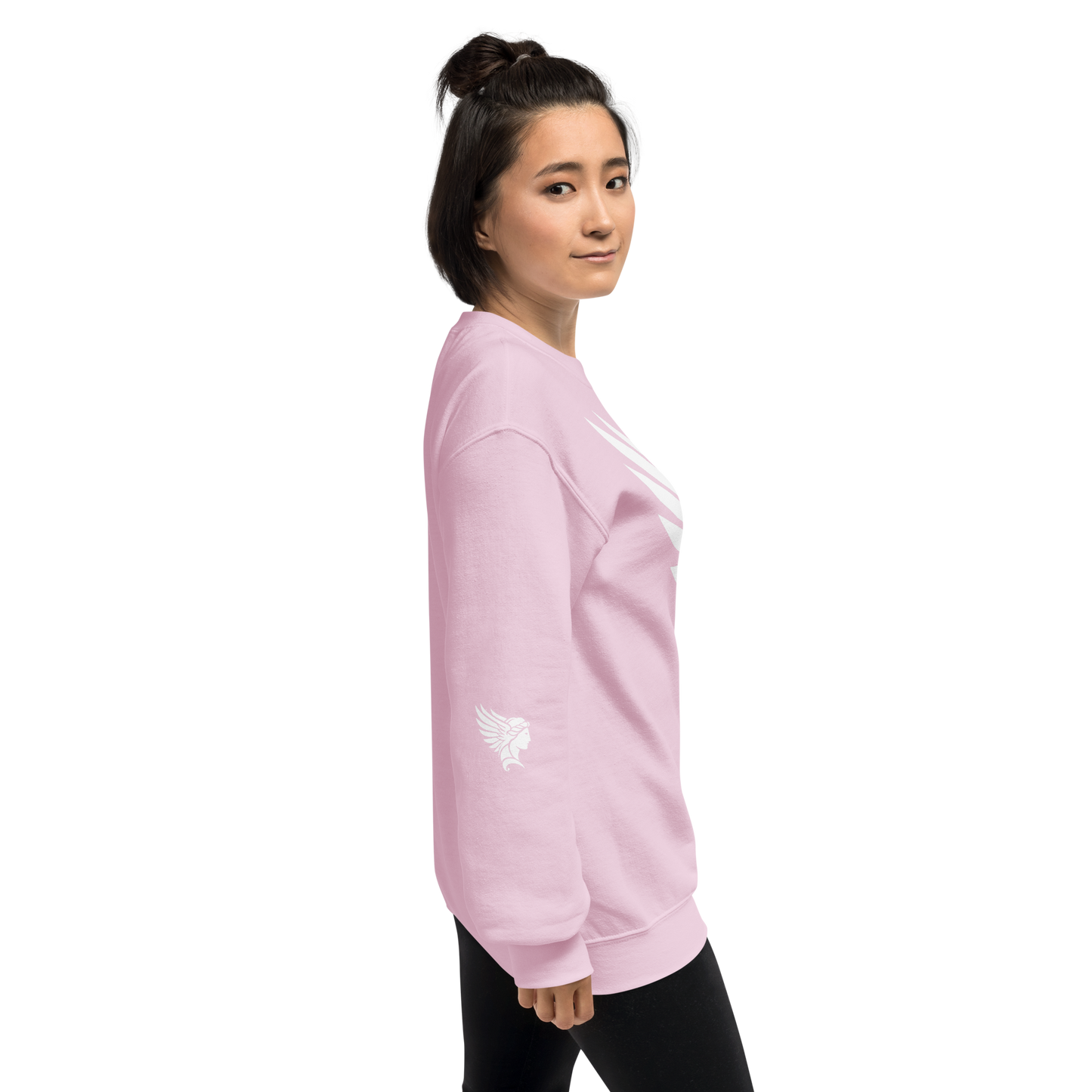 Hand holding 'She Illuminates Pathways' pink sweatshirt, showcasing soft fabric and ribbed collar.