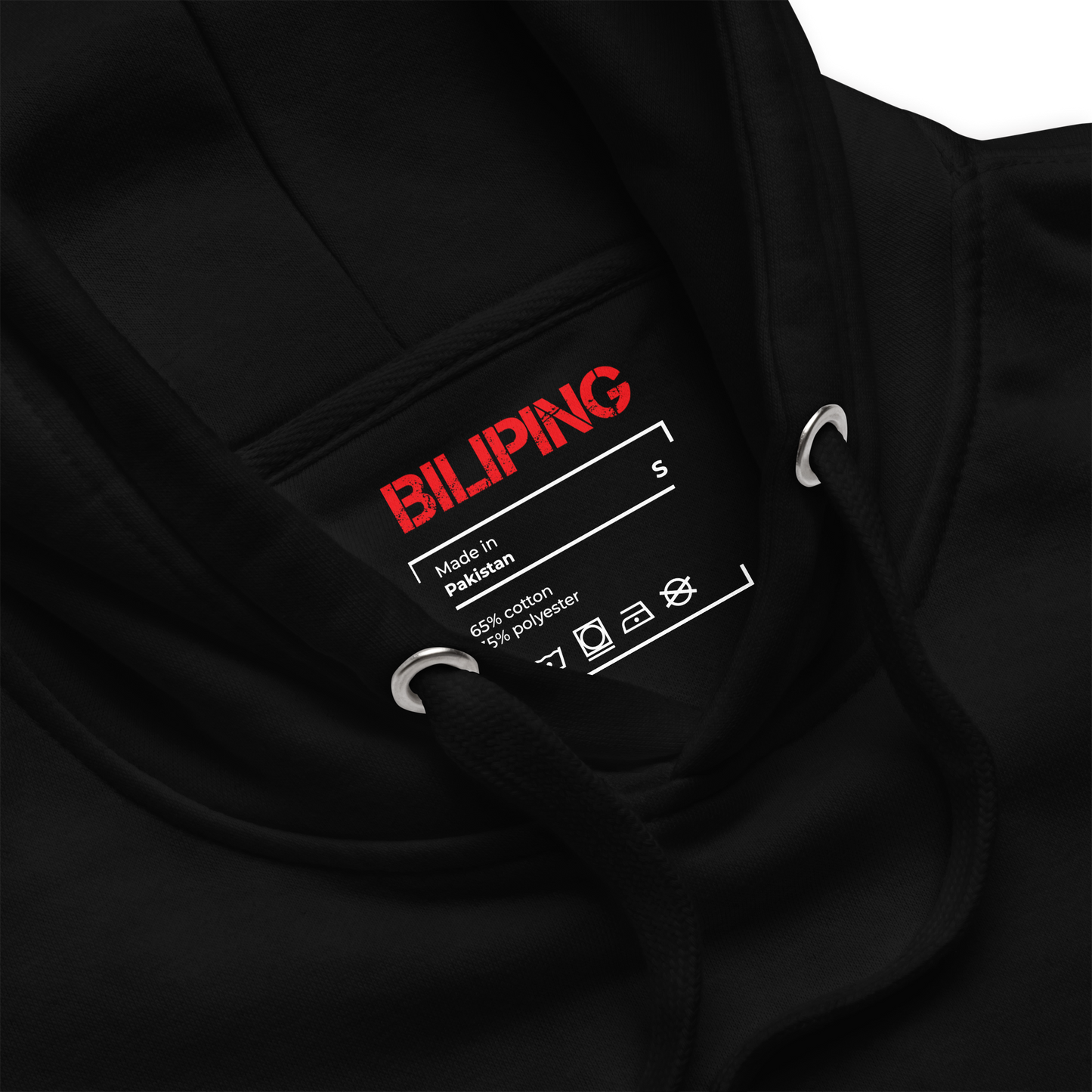 V - Hoodie with zipper and curved silver accent on black surface.