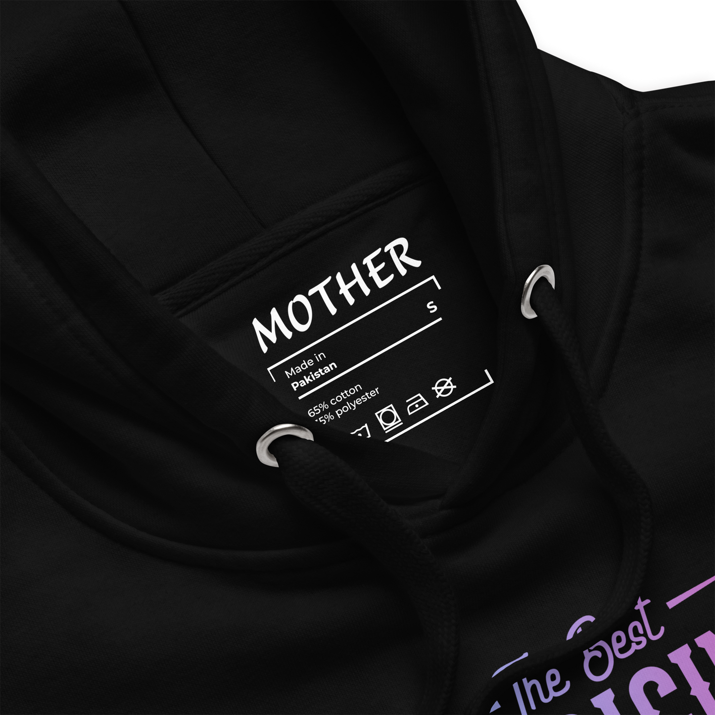 The Best Medicine hoodie label close-up with text on black background.