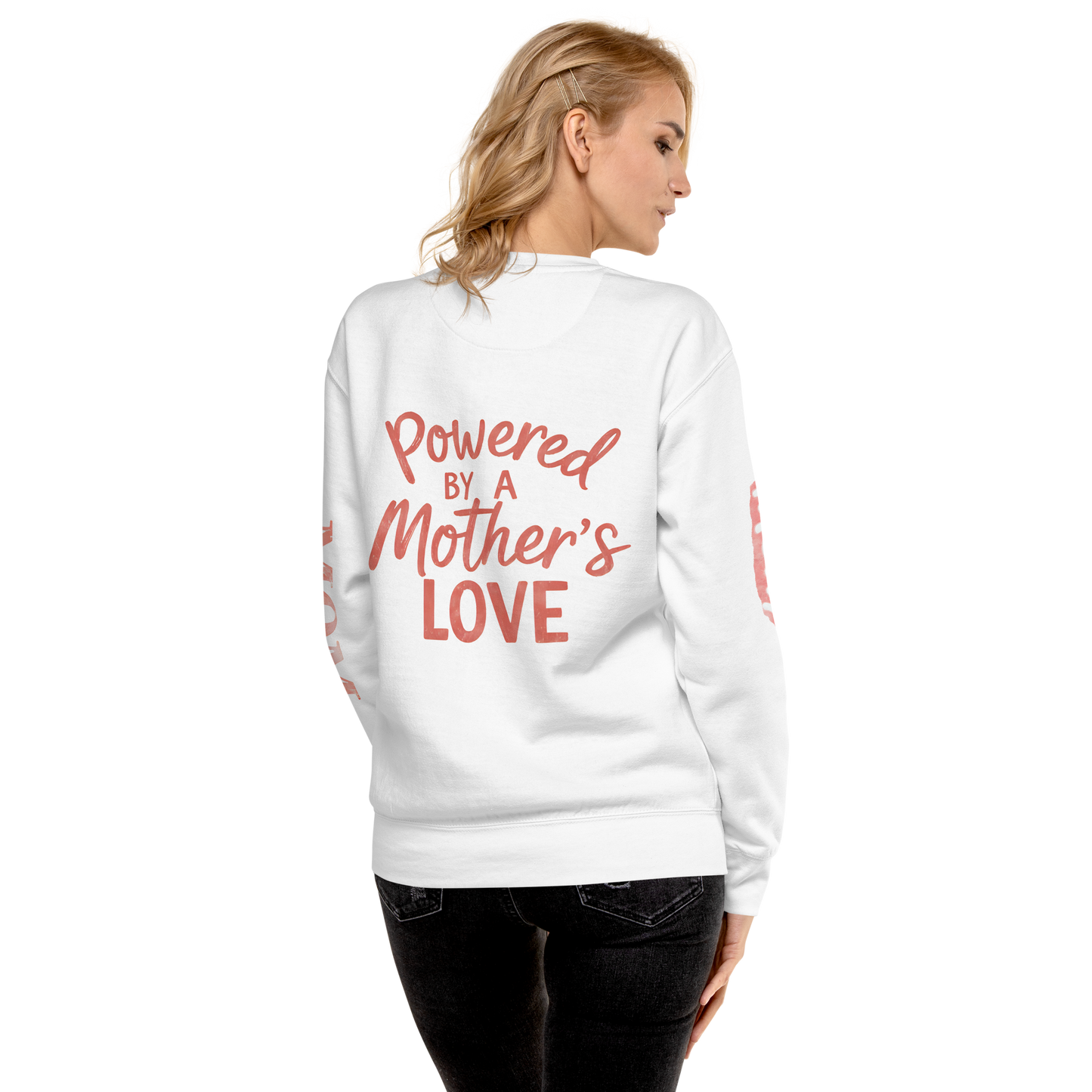 Person in 'Powered By A MOM' white sweatshirt, red text, casual style.