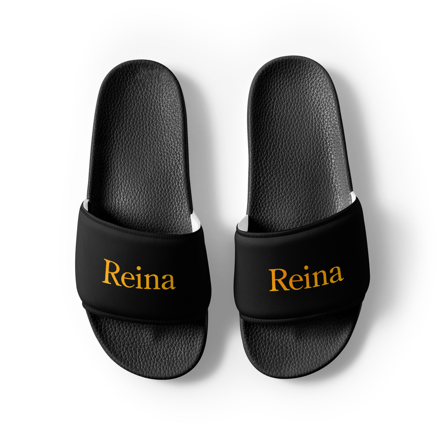 Reina black slippers with yellow text, showcasing cushioned faux leather strap.