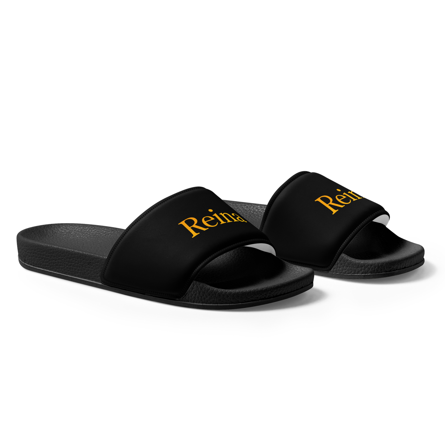 Reina sandals with cushioned faux leather strap and contoured footbed.