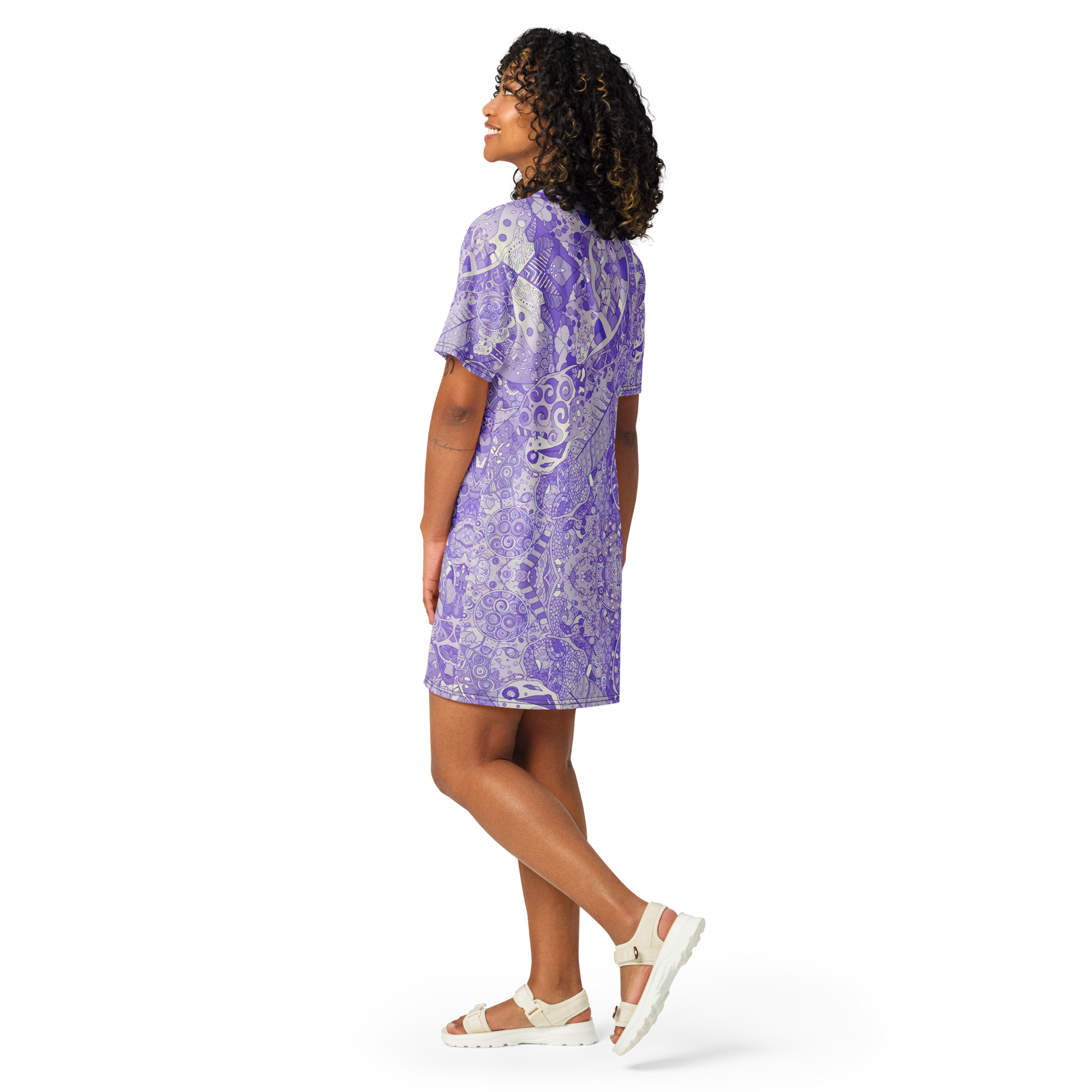 Close-up of feet in sandals, showcasing Lilaea's Labyrinth Dress's relaxed fit.