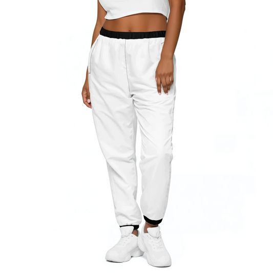 White Edition Track Pants worn with white sneakers, showcasing elastic ankle cuffs.