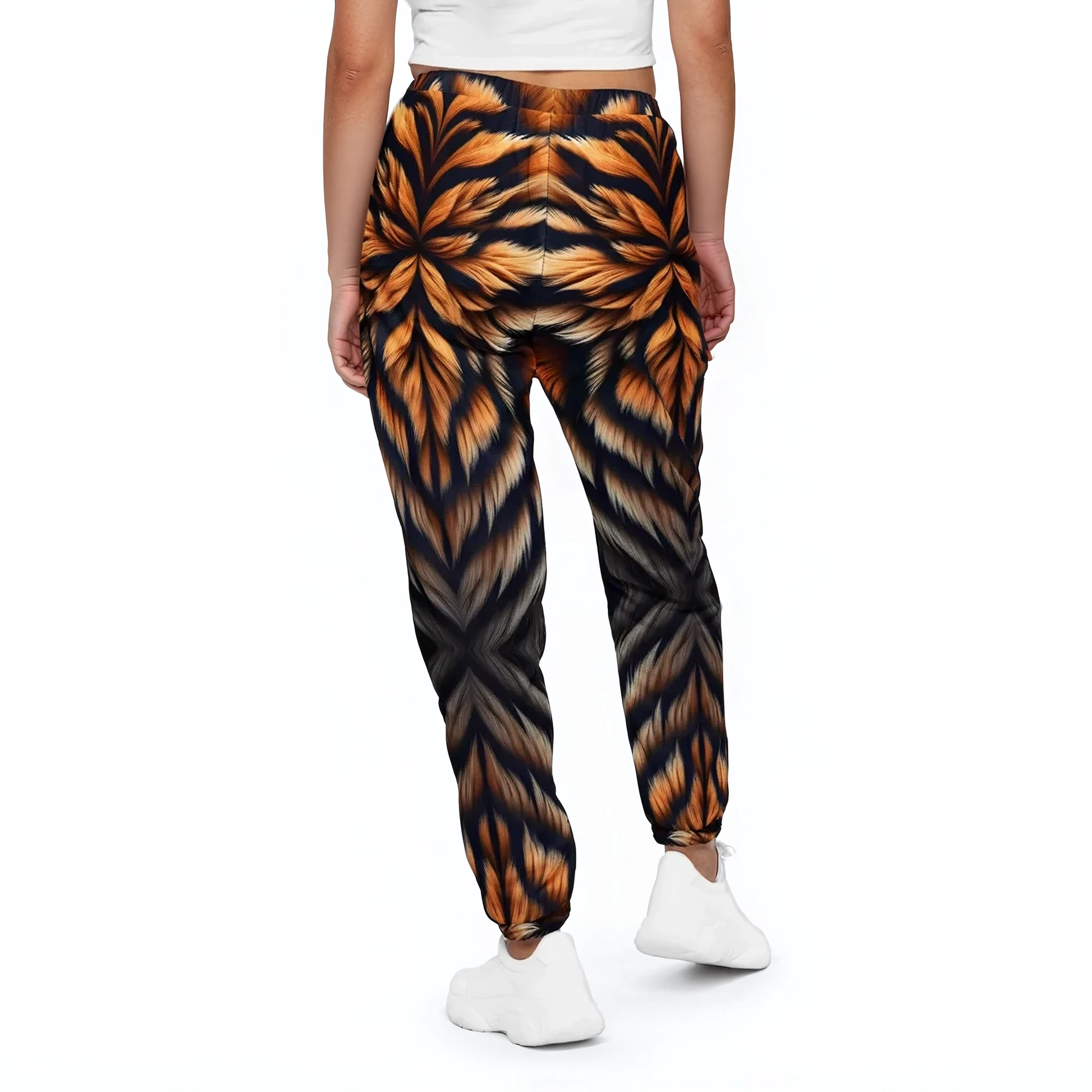 Ember Tiger Track Pants, worn with white shirt, showcasing elastic ankle cuffs.