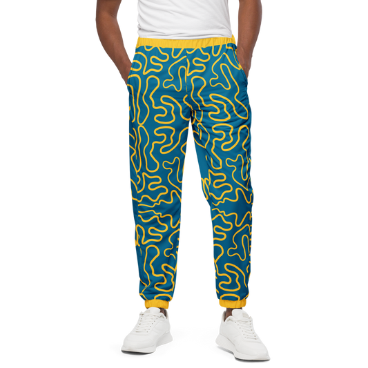 Wavy Line Track Pants with elastic ankle cuffs showcasing sneakers.