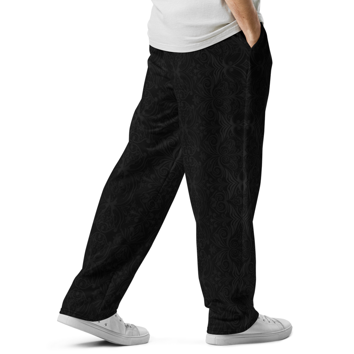 Ink Ivy Wide joggers, close-up of white shoe and arm, showcasing relaxed fit.