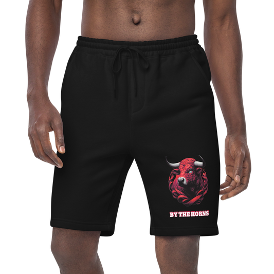 Men's Fleece Shorts: Close-up of man in black shorts, hand in pocket.