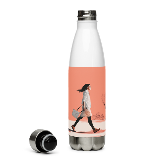 Wanderlight Sip water bottle held by a woman in white dress.