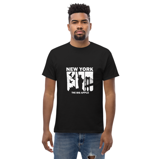 Man in BIG A TEE with New York graphics, paired with ripped jeans.