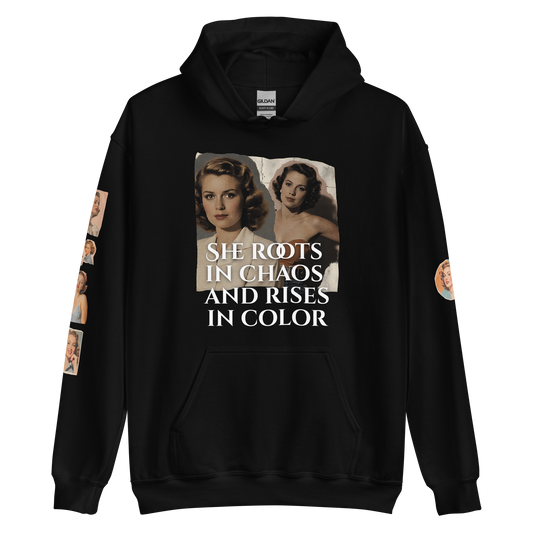 Woman wearing a Bloom Louder black hoodie with a white label, showcasing its soft, smooth design perfect for cool evenings, featuring a front pouch pocket.