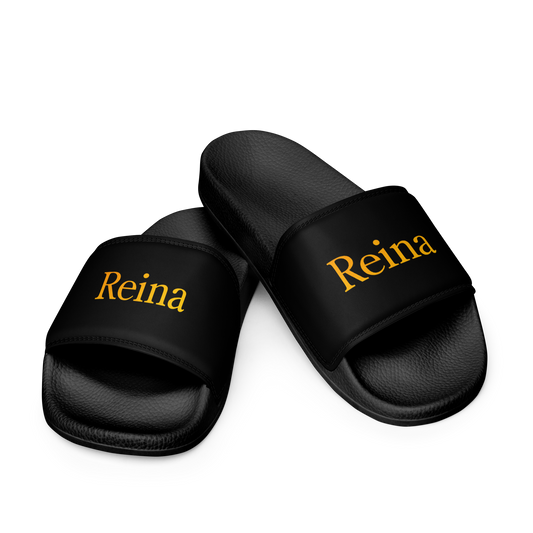 Reina black sandals with yellow text, featuring cushioned faux leather strap.